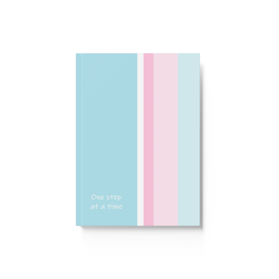 blue, pink and white vertical striped hardcover journal notebook with the words, one step at a time