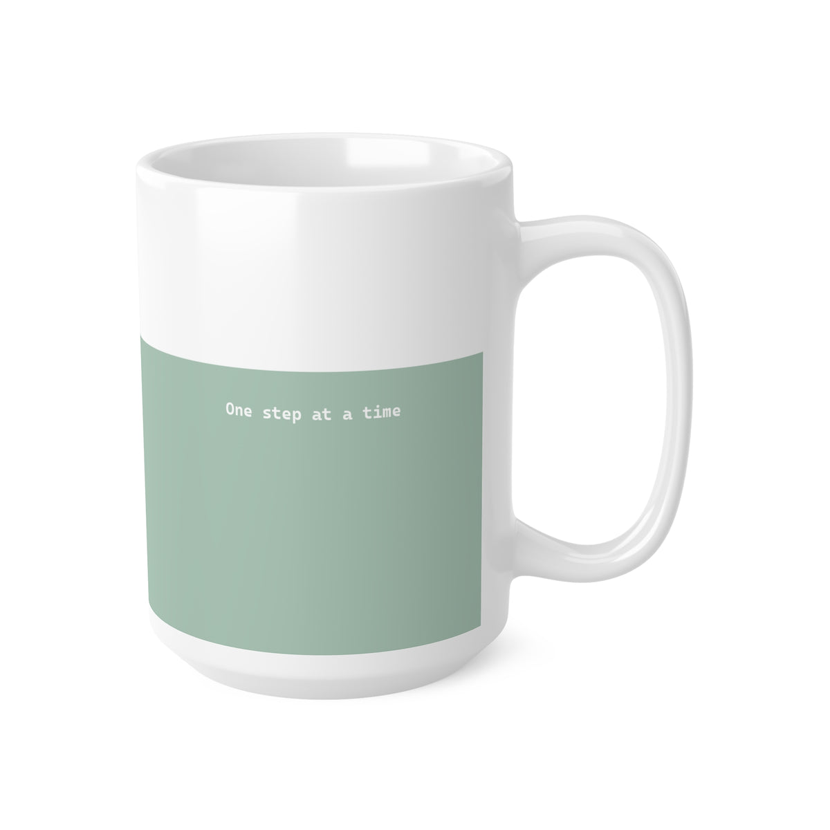 Right side view of green and white ceramic minimalist mug, 15oz size, showing ‘One step at a time’ text and handle