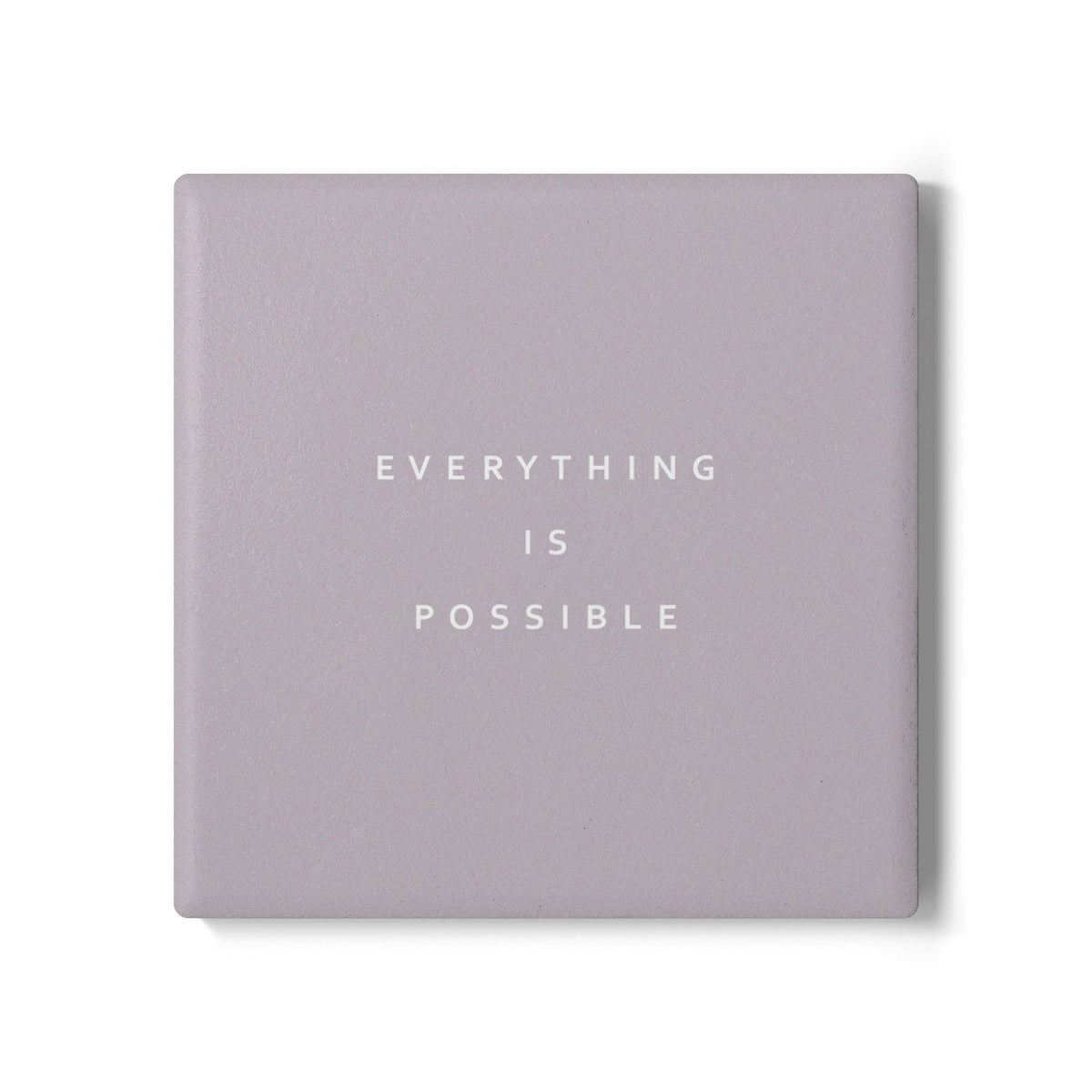 Brown square ceramic coaster with modern style text ‘Everything is possible’ in white font.