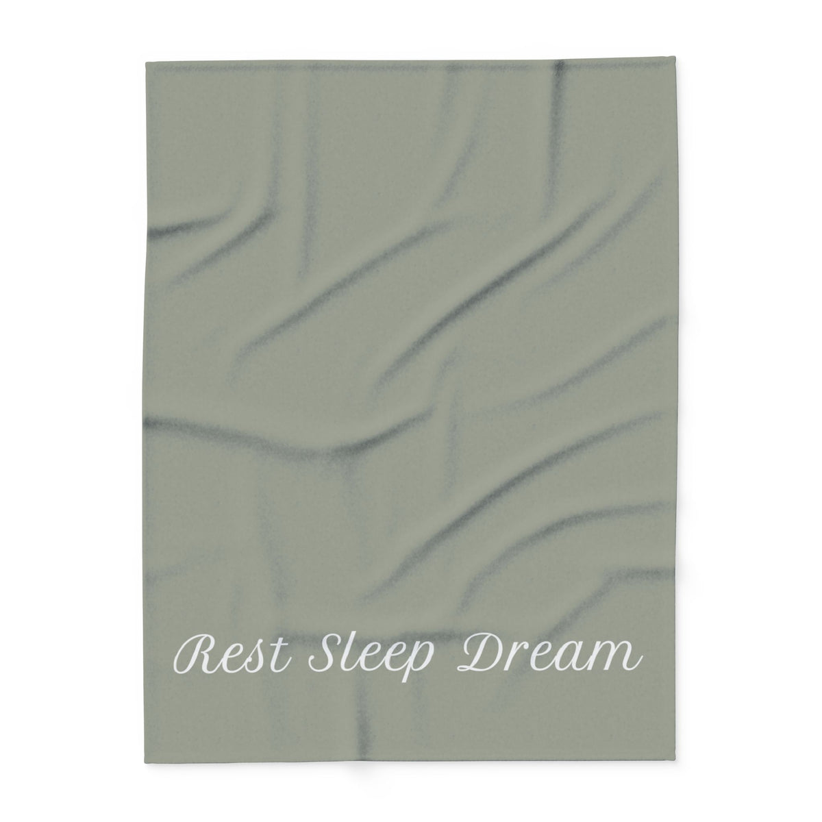 Green blanket with large, elegant font in white for the text ‘Rest Sleep Dream’ along the bottom.