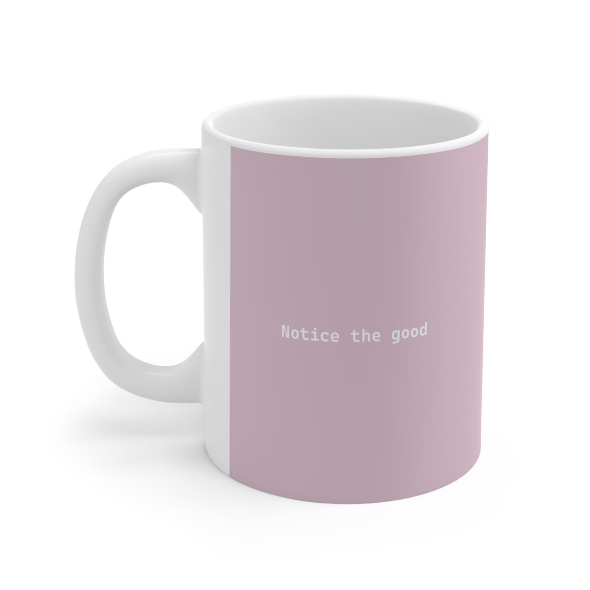 Left side view of pink ceramic minimalist mug, 11oz size, showing ‘Notice the good’ text and handle