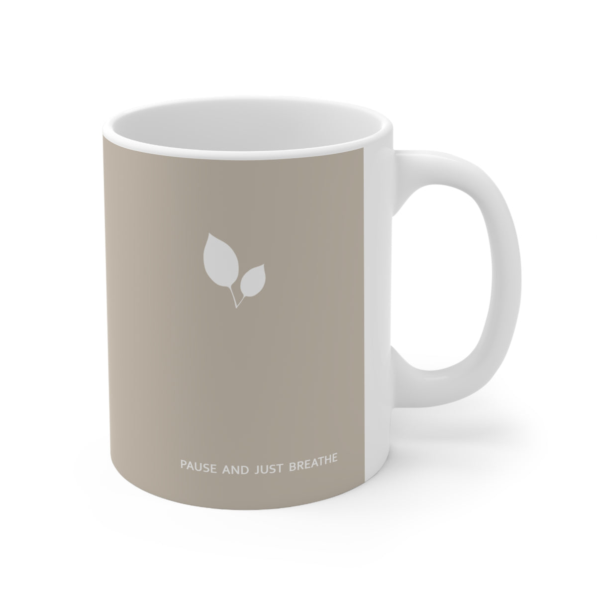Right side view of brown ceramic leaf mug, 11oz size, showing leaf cluster, ‘Pause and just breathe’ text and handle