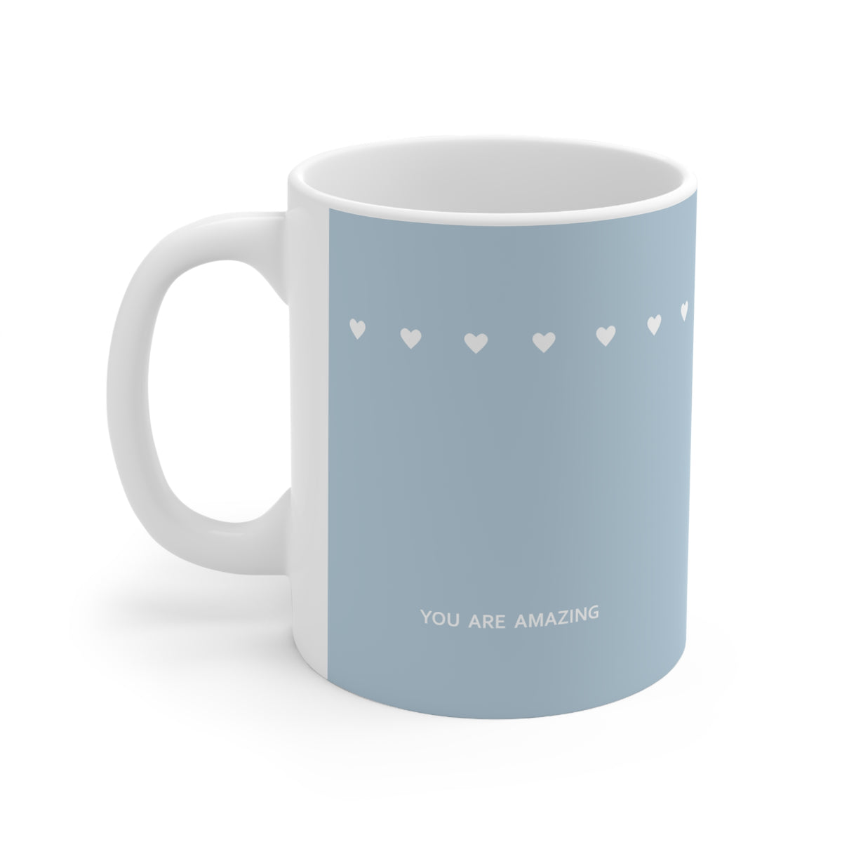 Left side view of blue ceramic tiny hearts mug, 11oz size, showing ‘You are amazing’ text and handle