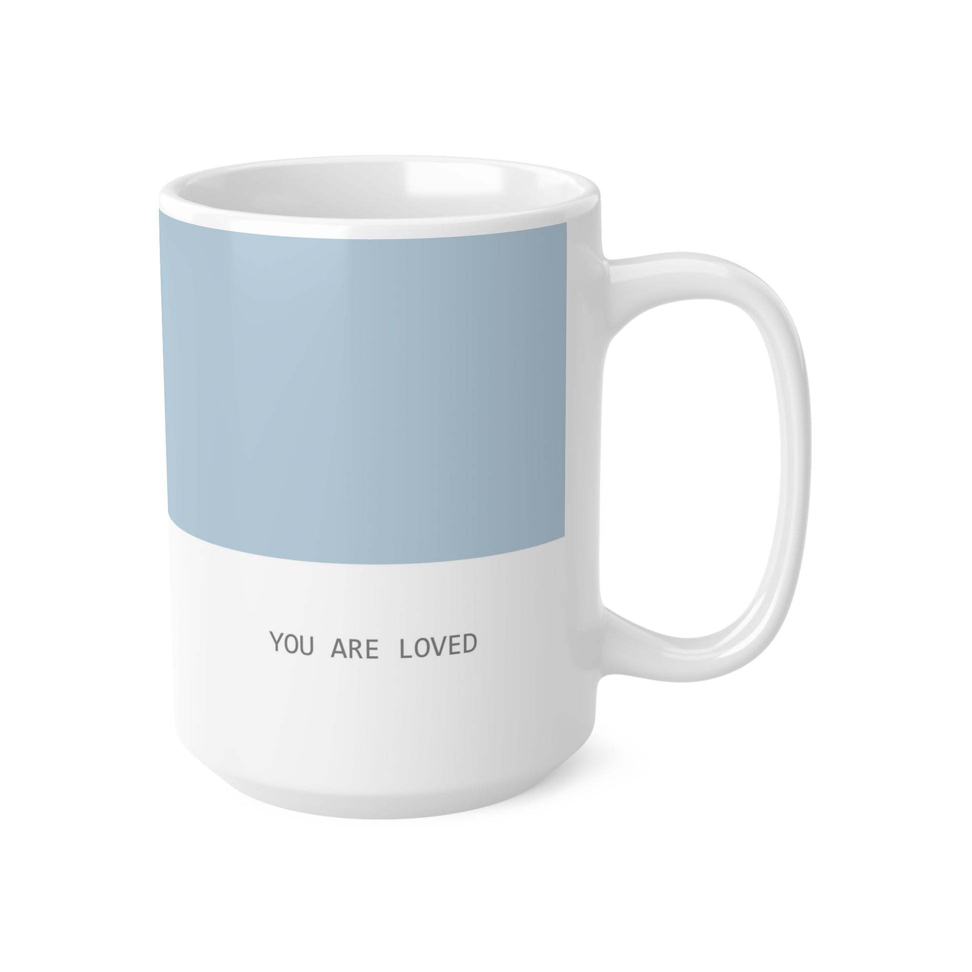 Right side view of blue and white ceramic minimalist mug, 15oz size, showing ‘you are loved’ text and handle