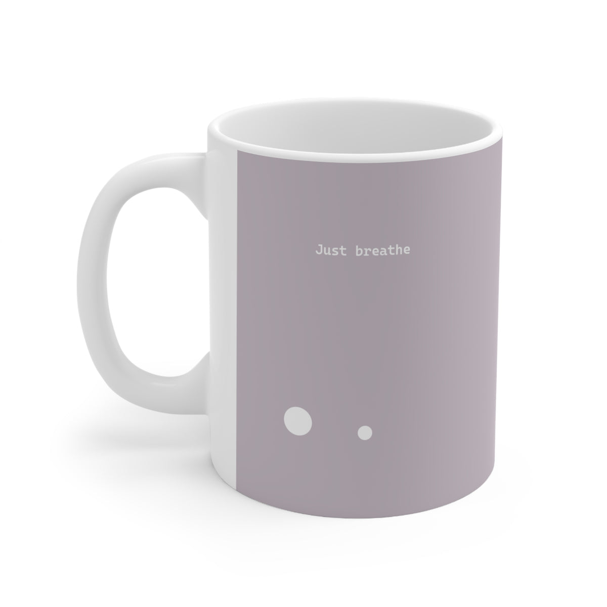 Left side view of brown ceramic circle mug, 11oz size, showing ‘Just breathe’ text and handle