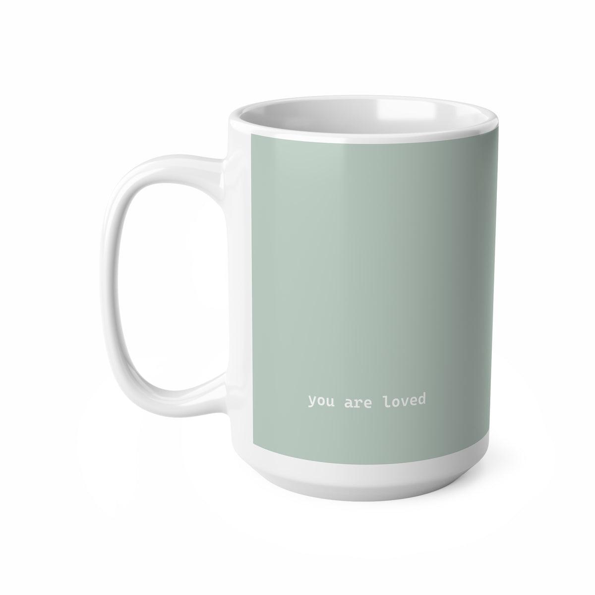 Left side view of green ceramic minimalist mug, 15oz size, showing ‘you are loved’ text and handle
