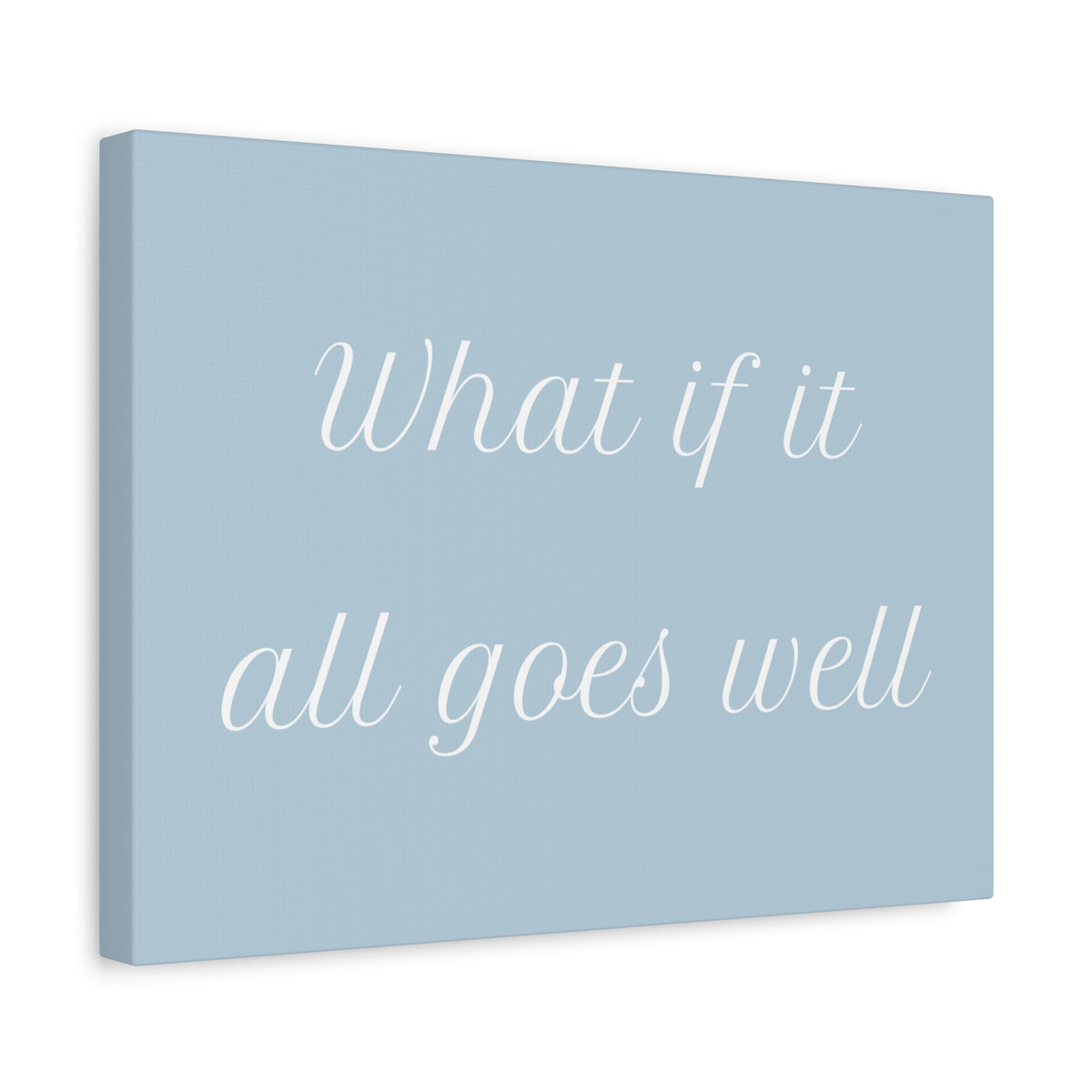 A canvas wall art print with the phrase 'What if it all goes well' in white cursive text on a light blue background, shown at a slight angle against a white backdrop.