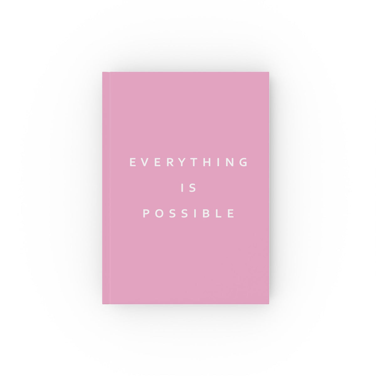 A pink hardcover notebook with the phrase 'EVERYTHING IS POSSIBLE' printed in white sans-serif text on the front cover, centered against a plain white background.