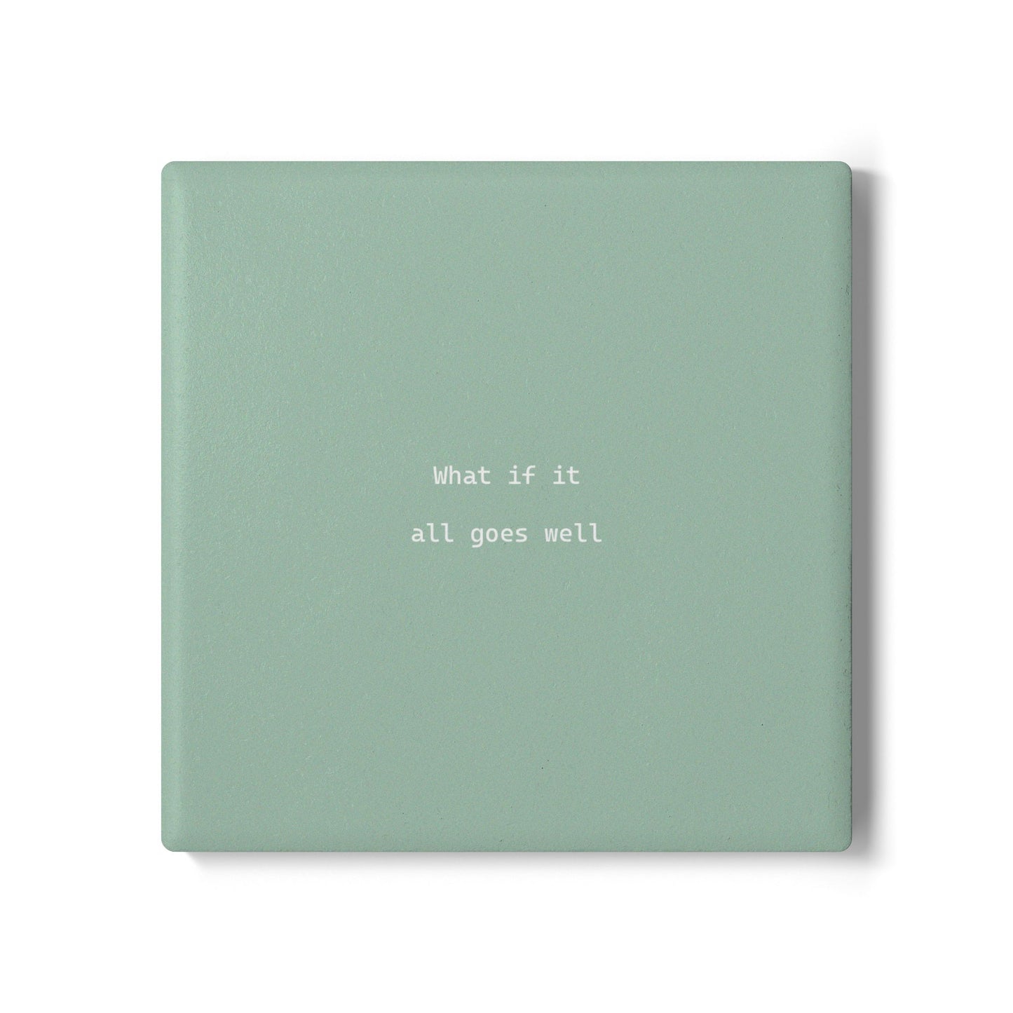 Green square ceramic coaster with modern style text ‘What if it all goes well’ in white font.