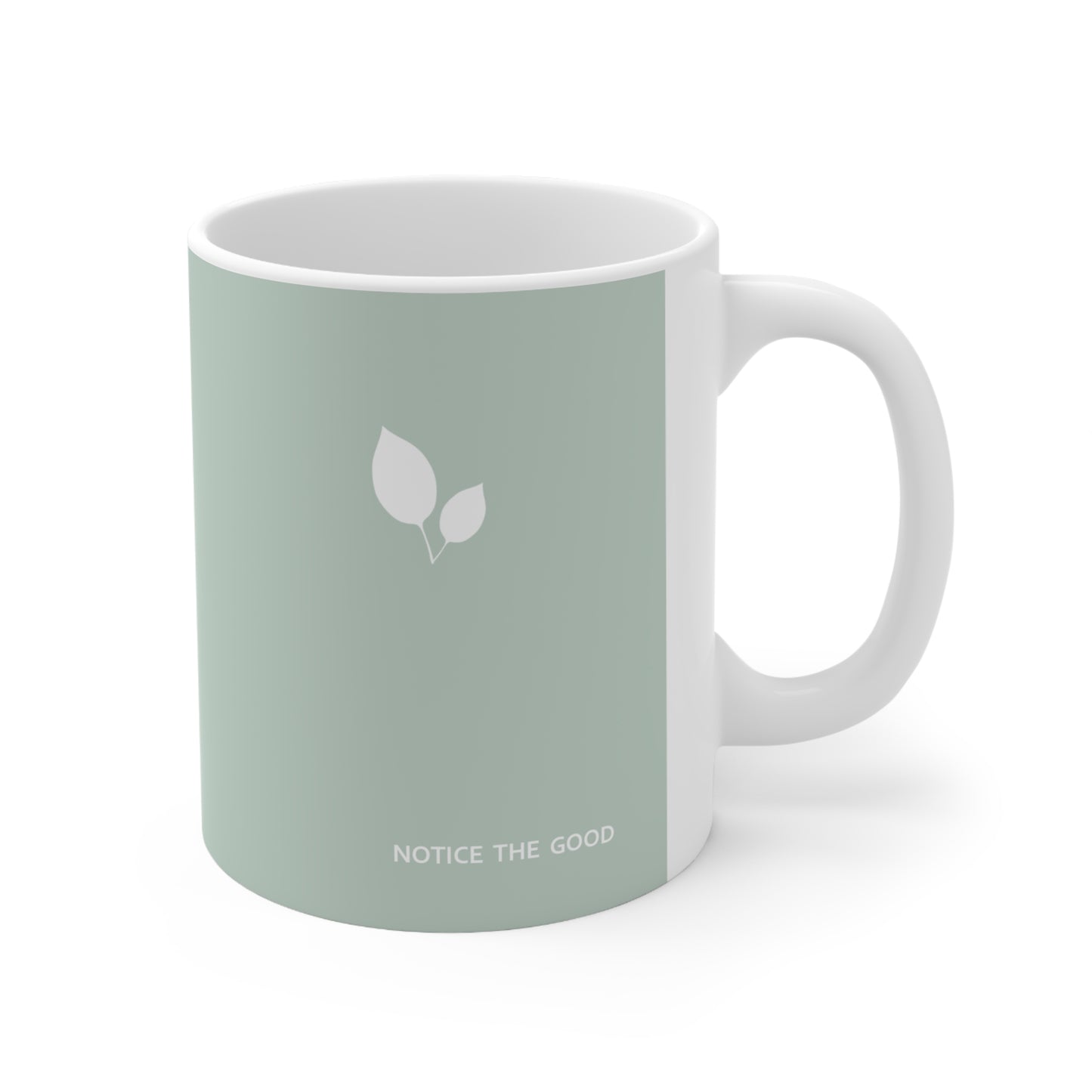 Right side view of green ceramic leaf mug, 11oz size, showing leaf cluster, ‘Notice the good’ text and handle