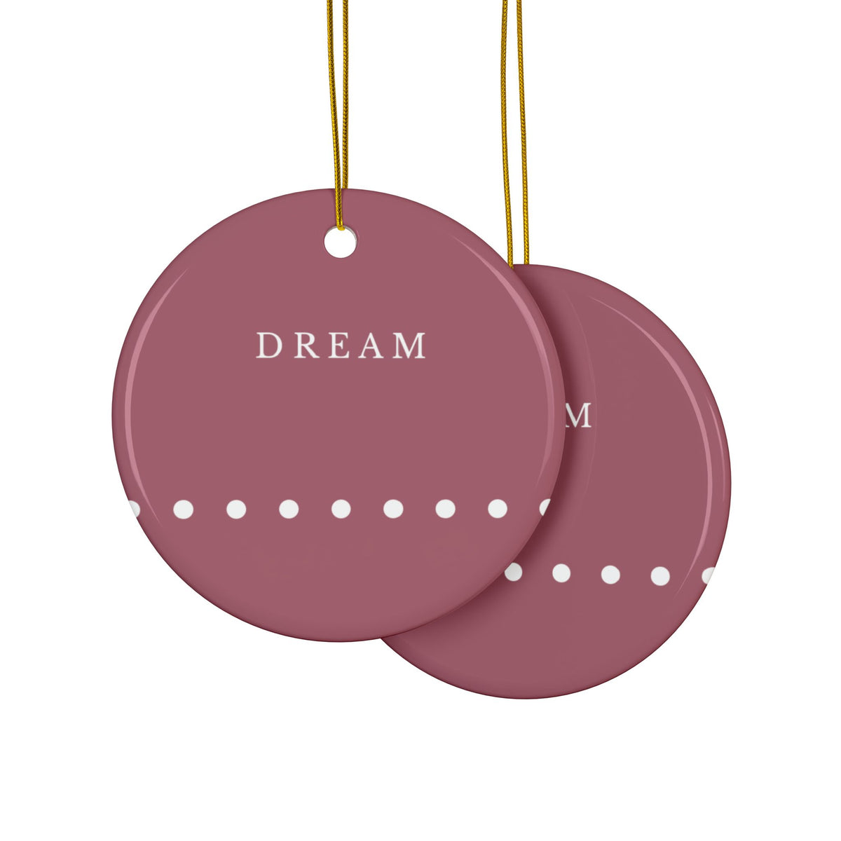Overlapping round ceramic hanging ornaments. Dark red with row of white dots at the bottom. The word 'DREAM' in white at the top.