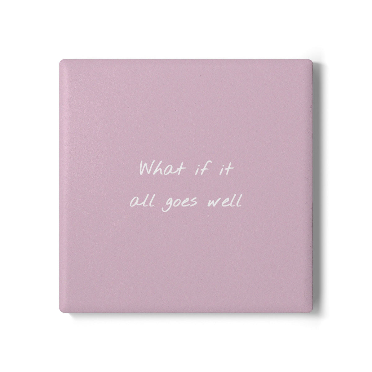Pink square ceramic coaster with handwritten style text ‘What if it all goes well’ in white font.
