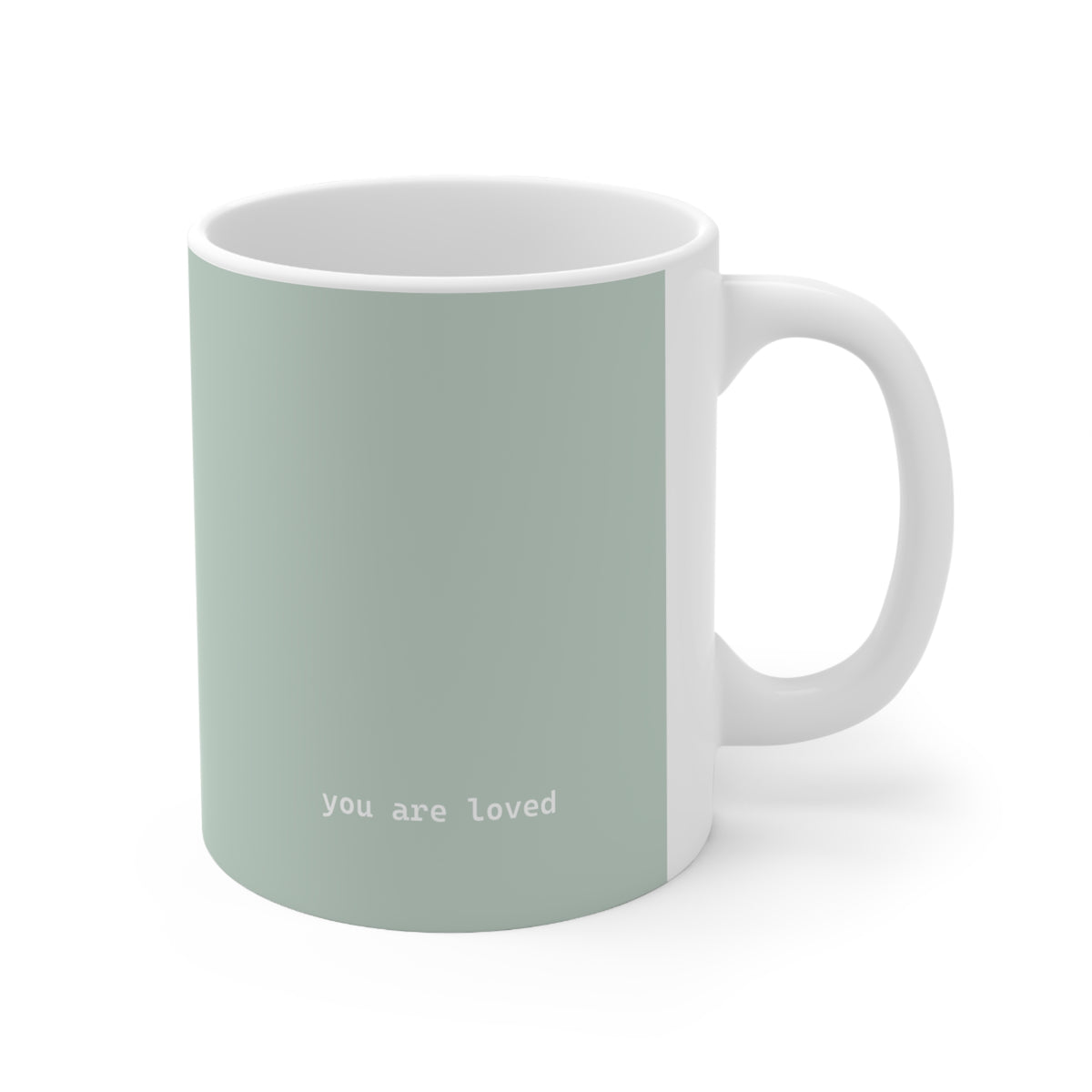Right side view of green ceramic minimalist mug, 11oz size, showing ‘you are loved’ text and handle