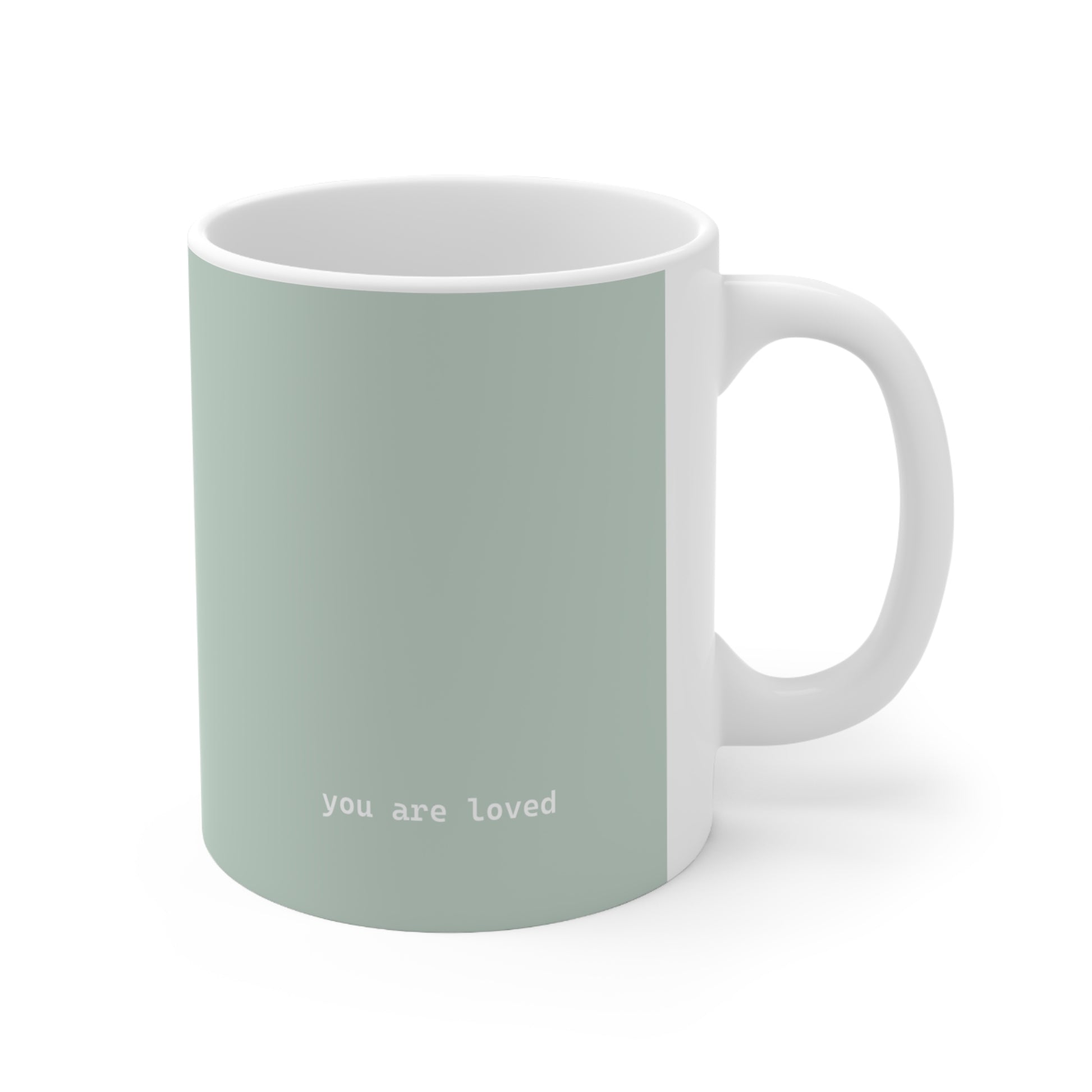Right side view of green ceramic minimalist mug, 11oz size, showing ‘you are loved’ text and handle