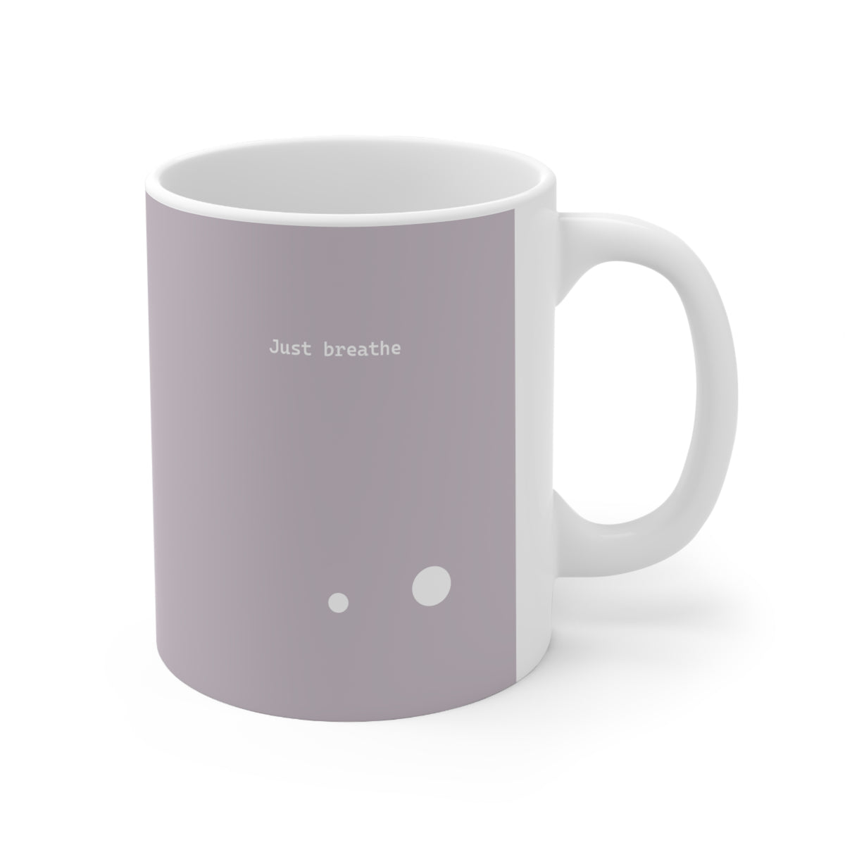 Right side view of brown ceramic circle mug, 11oz size, showing ‘Just breathe’ text and handle