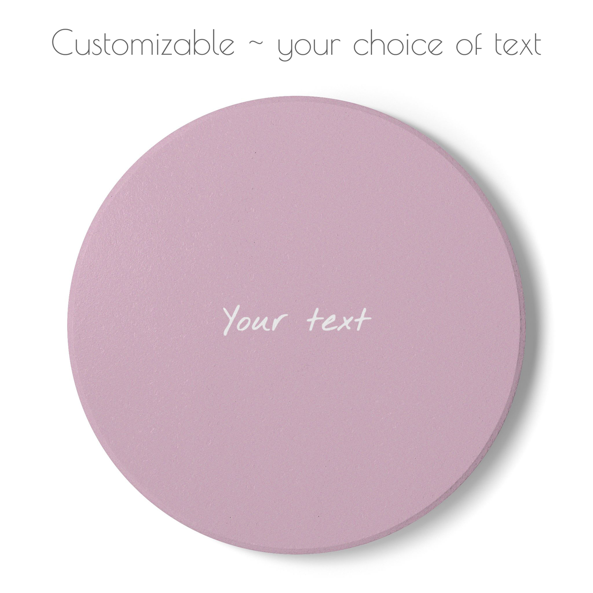 Pink round ceramic coaster with your choice of personalized text. 