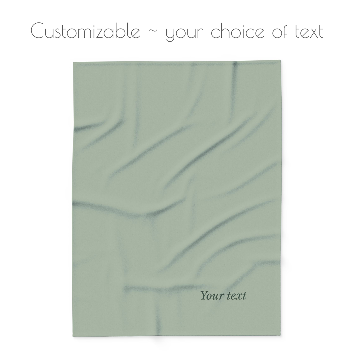A customizable sage green blanket, featuring placeholder text 'Your text' and a header that reads 'Customizable ~ your choice of text' on a white background.