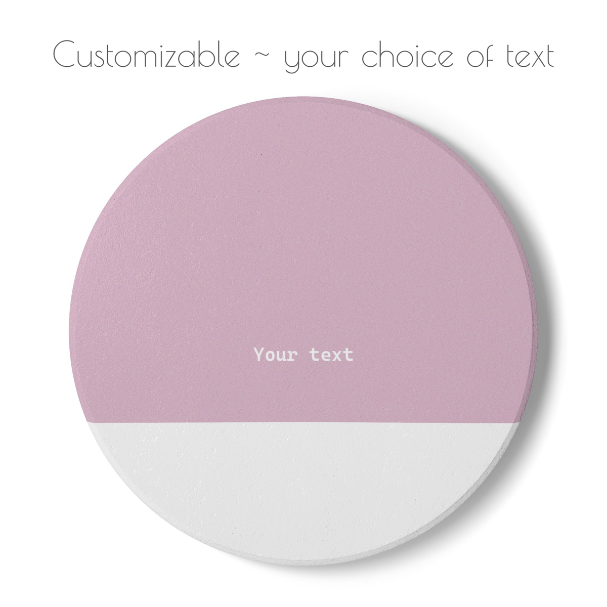Pink and white round ceramic coaster with your choice of personalized text. 