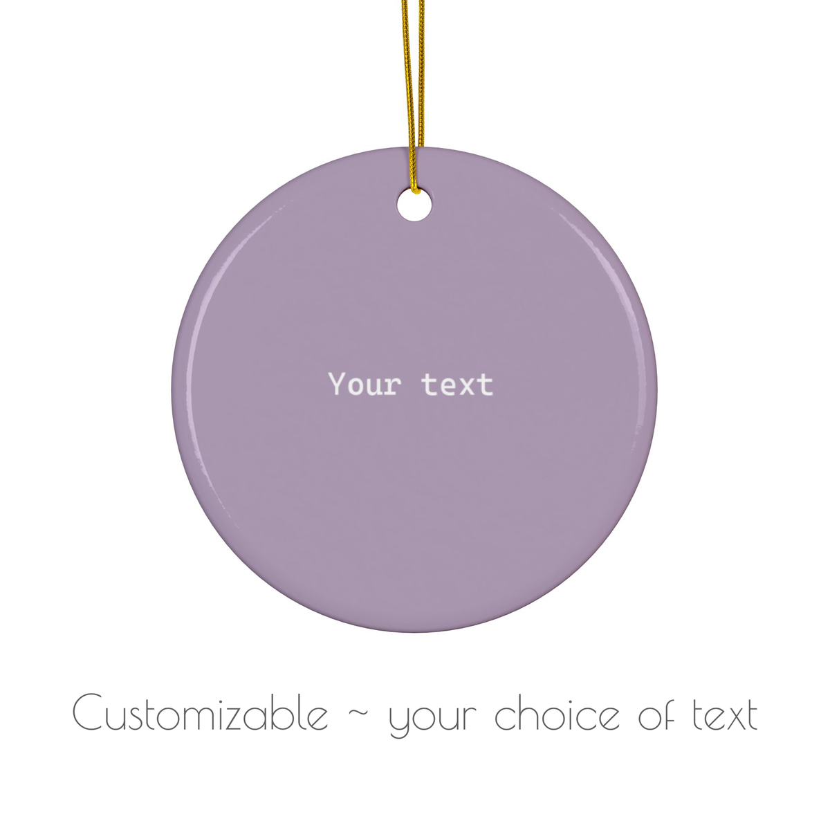 A round lavender ceramic ornament with a hanging loop, featuring the placeholder text 'Your text' in white. Below the ornament, the text 'Customizable ~ your choice of text' is displayed on a clean white background.
