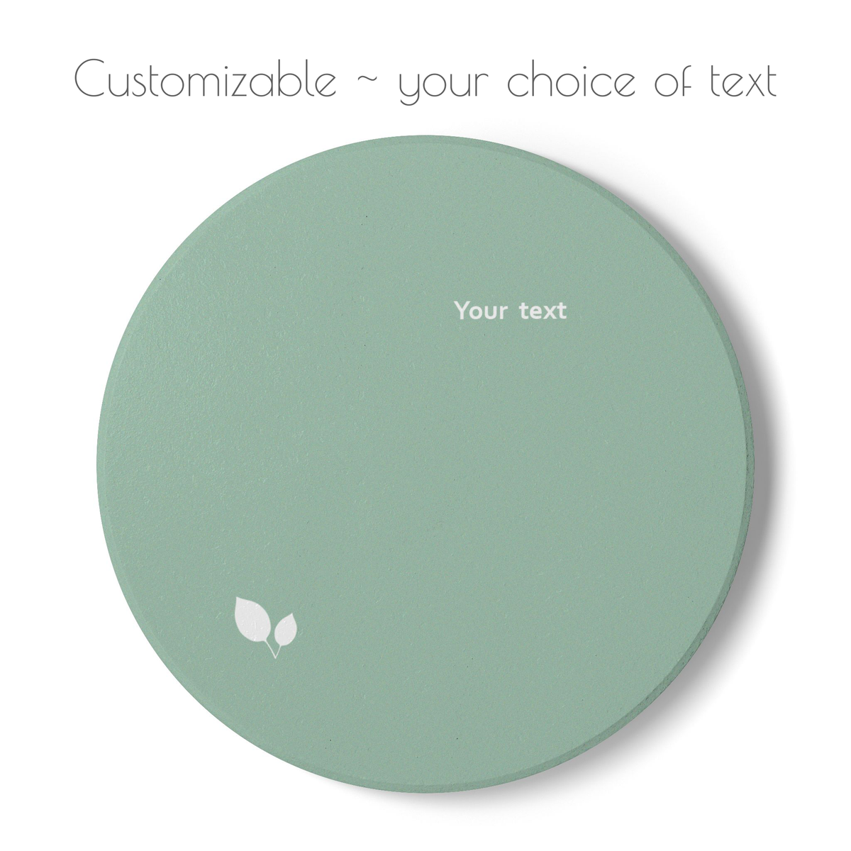 Green round ceramic coaster with delicate leaf motif design, and your choice of personalized text. 