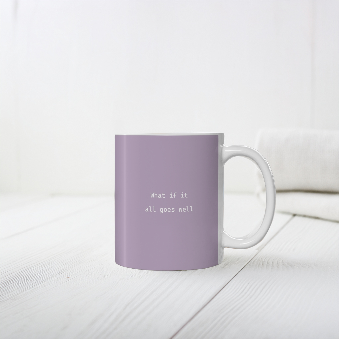 11oz purple ceramic minimalist mug. Small white font in the middle ‘What if it all goes well’.  The mug sits on a white surface, minimalist background.