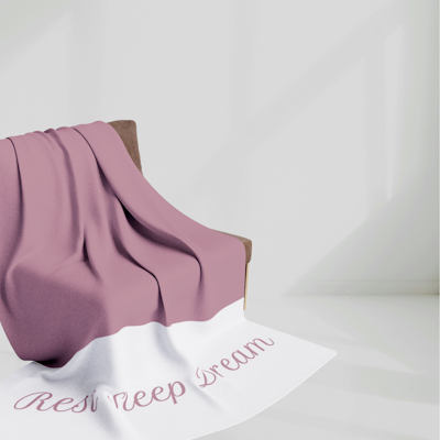 purple berry and white blanket with the words, Rest Sleep Dream