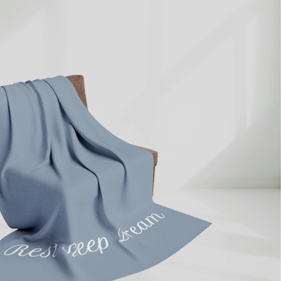 dark blue and white blanket with the words Rest Sleep Dream