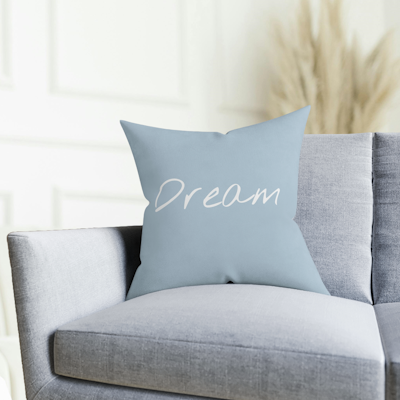 blue cushion with the word, dream