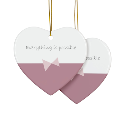 dark pink and white heart ceramic ornament with bow in the middle and the words, everything is possible