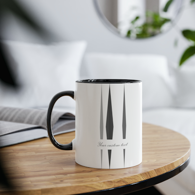 white ceramic mug with vertical dark grey diamond shapes design, and words which you can customise with your own personal words. black handle and black inside.