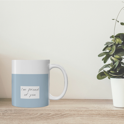 blue and white ceramic mug with words, I'm proud of you